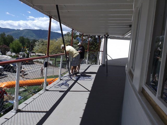 Penticton-Flood-Sicamous-Don-Matt-hauling-electrical-line-up-above-water-level.jpg