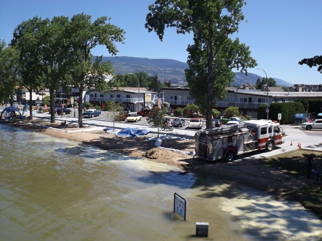 SS-Sicamous-Fire-Trucks-on-the-beach-after-sand-has-been-pumped-under-the-hull-to-bring-the-ship-above-the-high-water-level.jpg