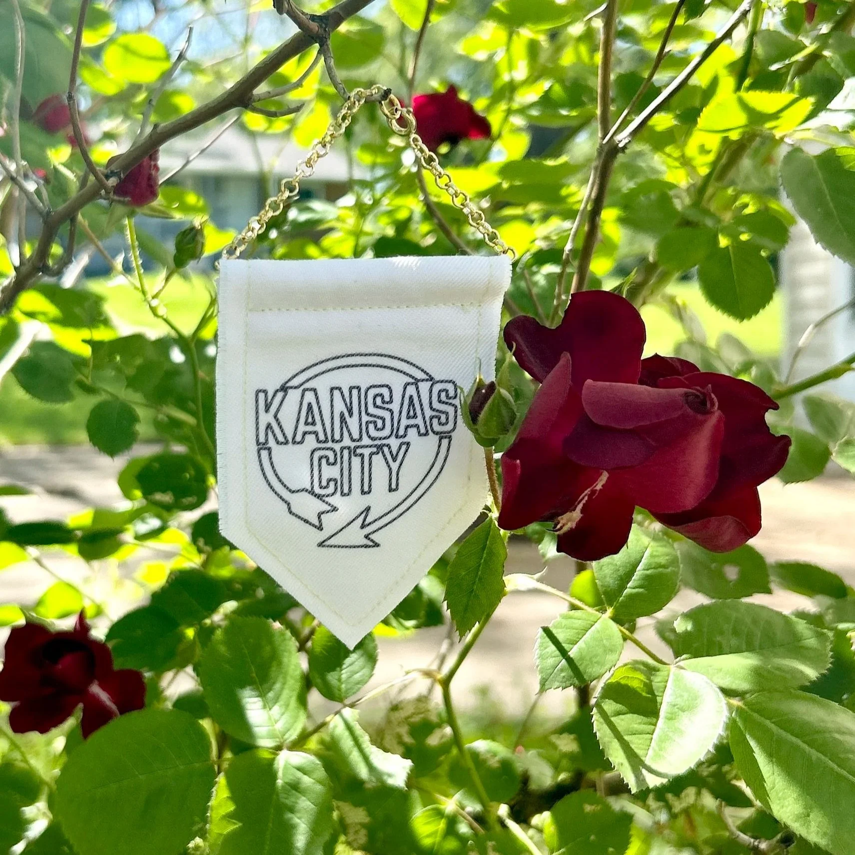 Handmade upcycled white fabric mini banner with black "Kansas City" logo infused ink design