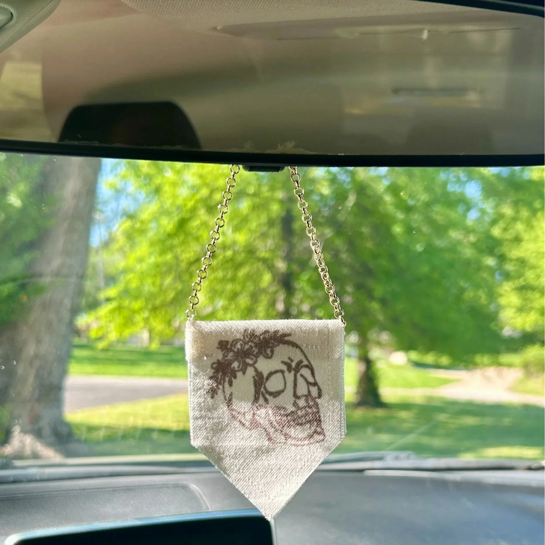 Handmade upcycled white fabric mini banner with black skull and flowers design infused ink design