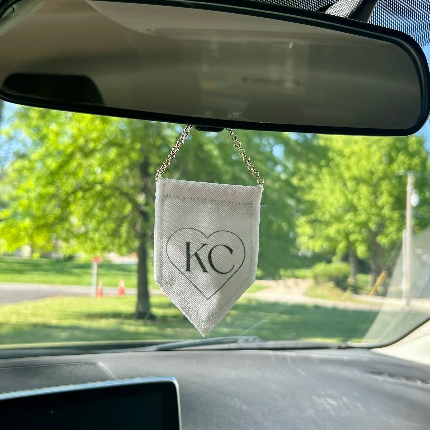 Handmade upcycled white fabric mini banner with black "Kansas City" logo infused ink design