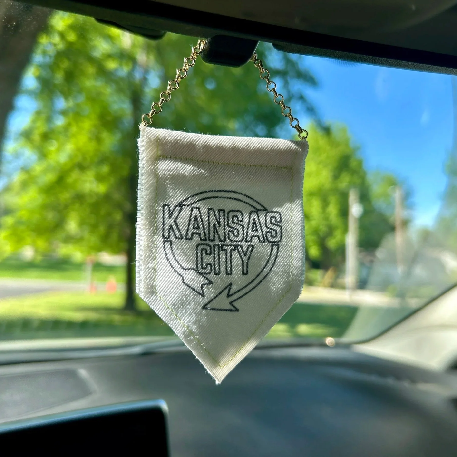 Handmade upcycled white fabric mini banner with black "Kansas City" logo infused ink design