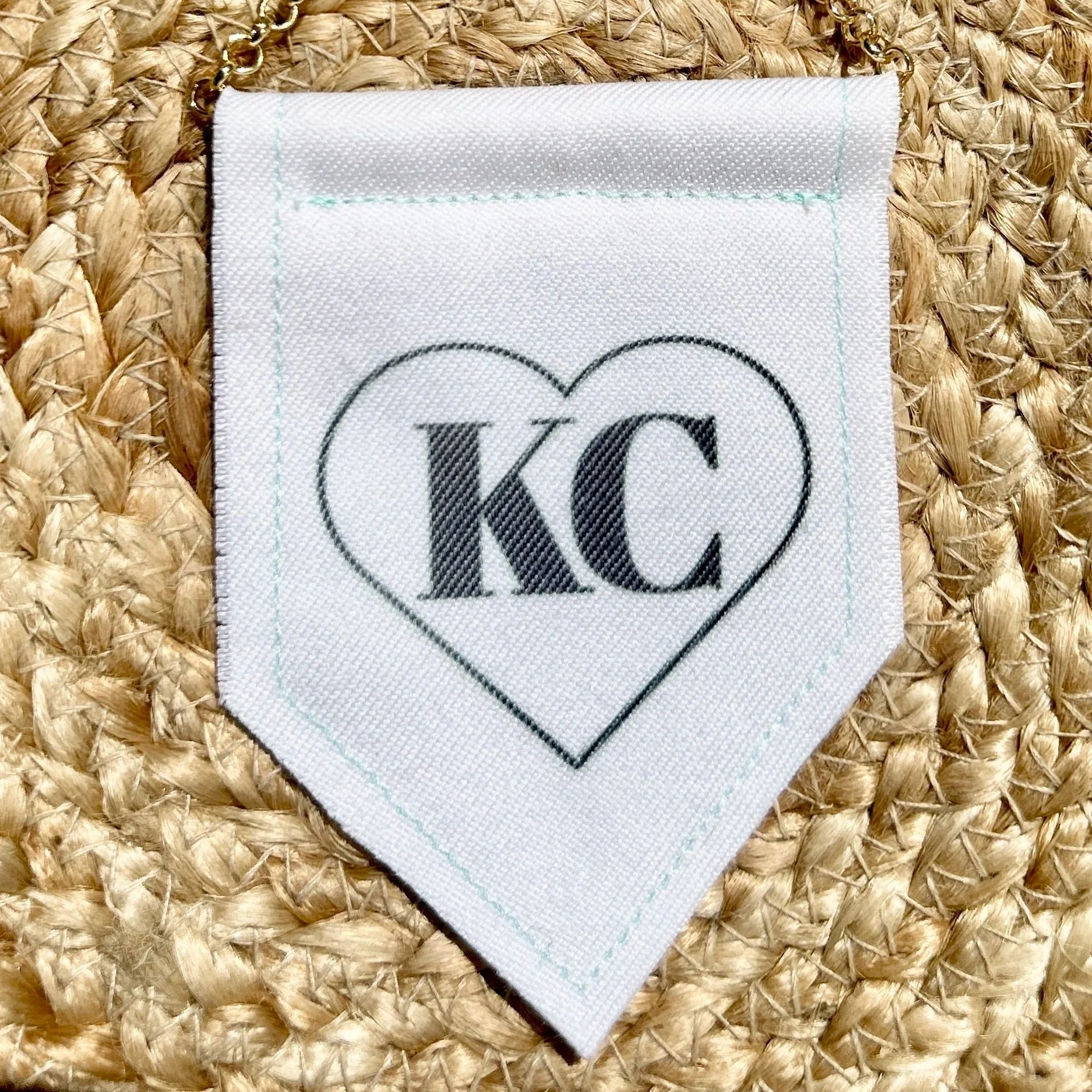 Handmade upcycled white fabric mini banner with black "Kansas City" logo infused ink design