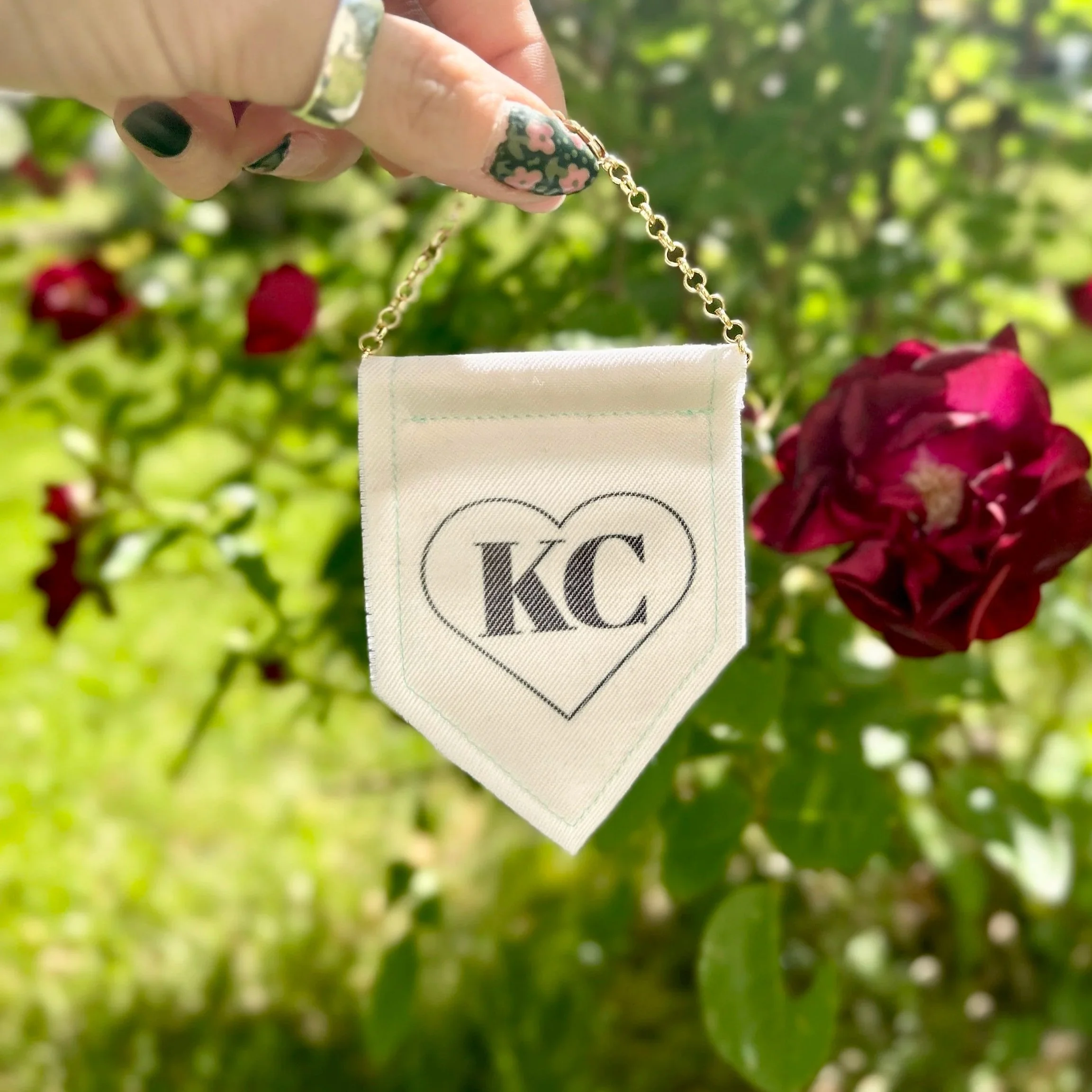 Handmade upcycled white fabric mini banner with black "Kansas City" logo infused ink design
