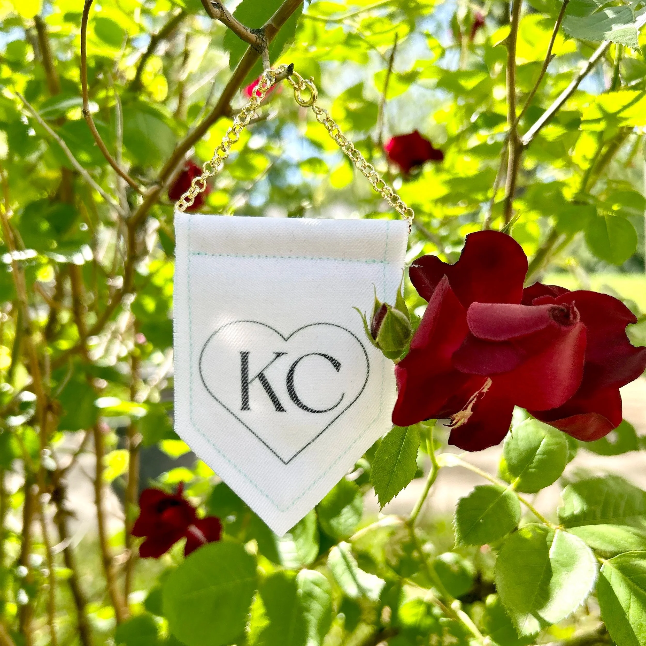 Handmade upcycled white fabric mini banner with black "Kansas City" logo infused ink design