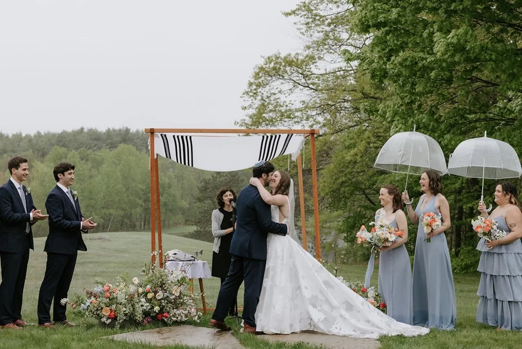 we don&rsquo;t mind a little rain 🩵 

photography: @jillhoylephotography 
planning: @dirigoeventco 
venue: @cunninghamfarmmaine 
floral design: @floraliadesignstudio 

#weddingflowers #mainewedding #springwedding #springflowers #ceremonyflowers