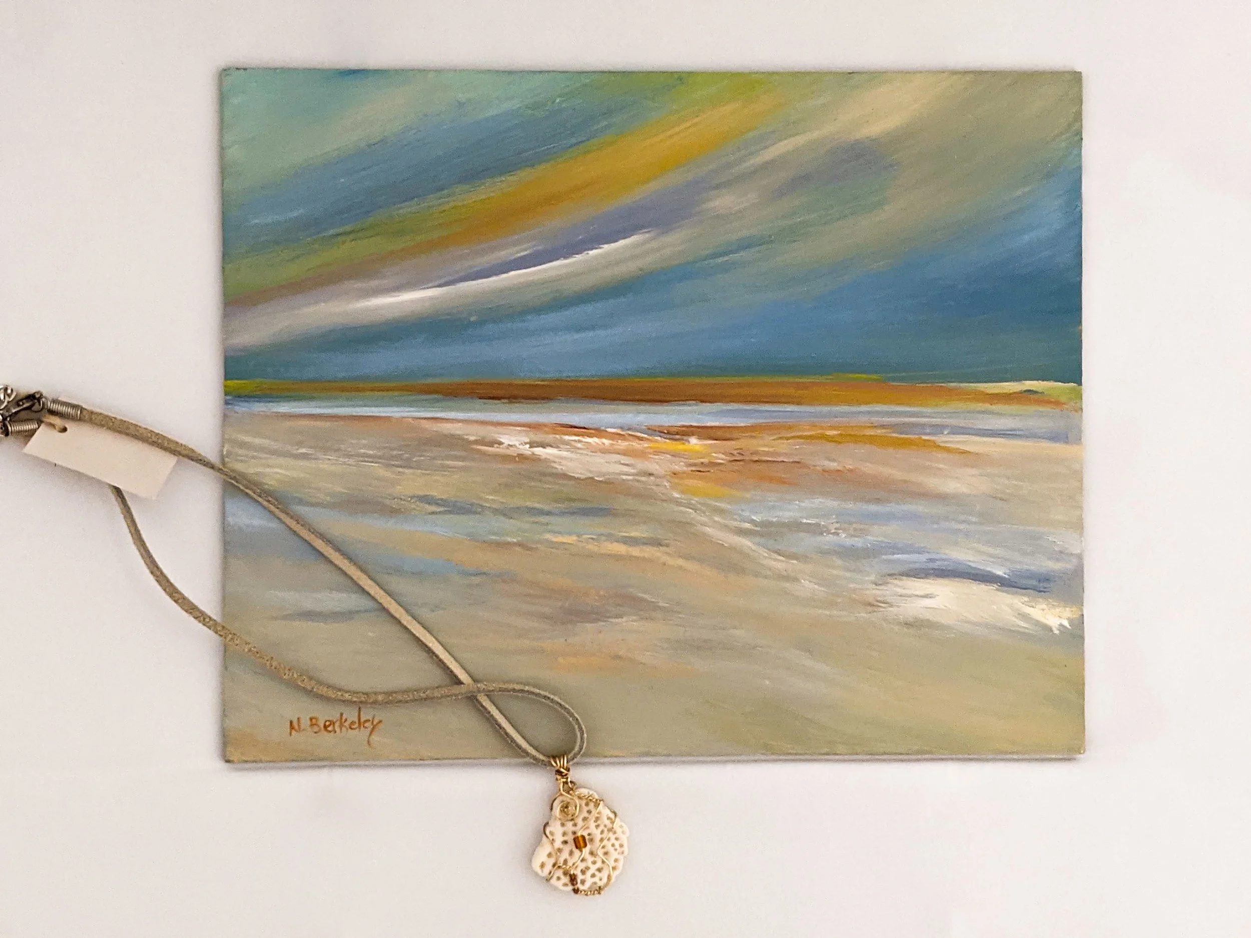 Amber Sky, Oil on Panel. Unframed.

Wire Wrapped Coral Pendant on Leather Cord.