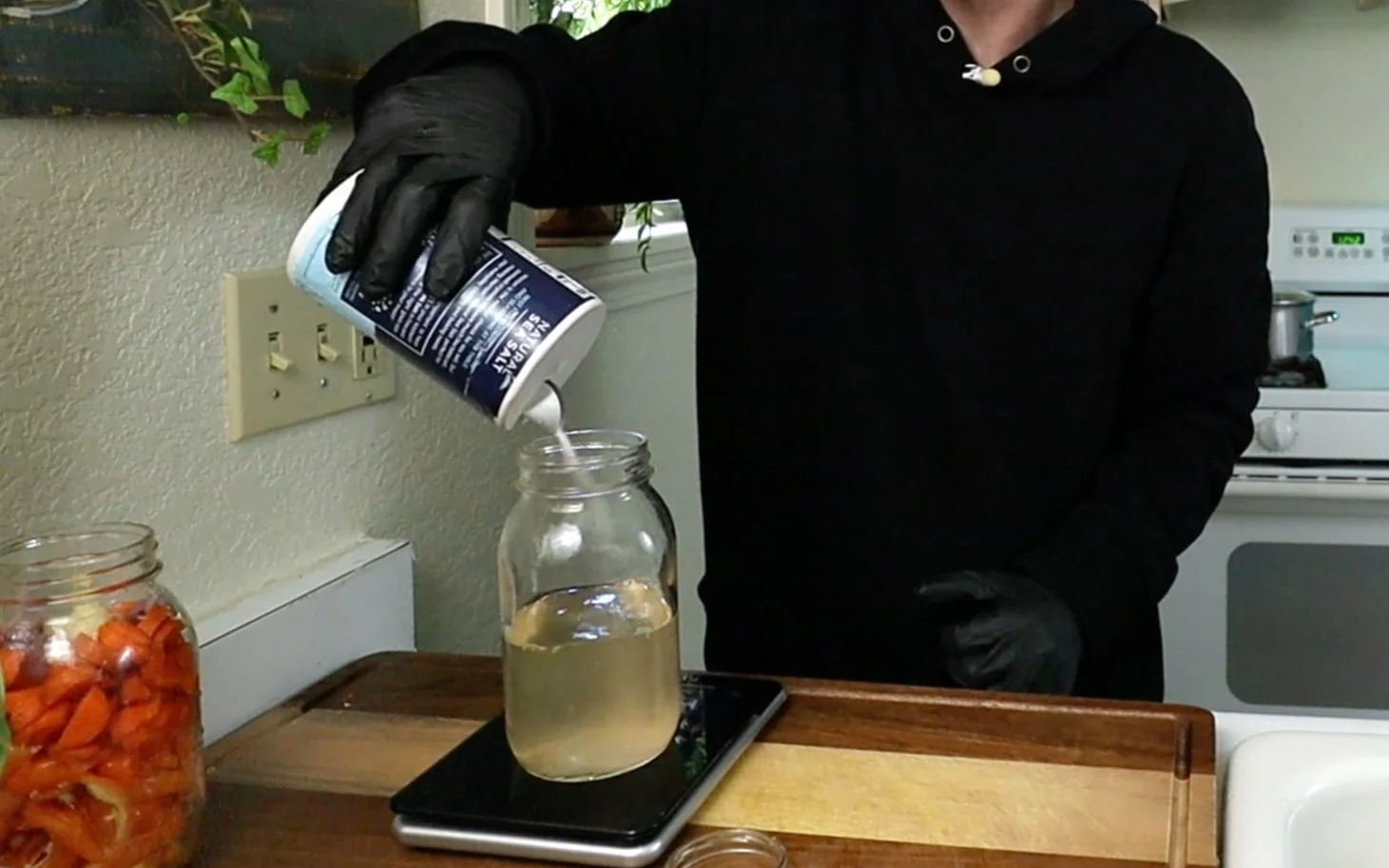 adding salt to the water to make the salt water solution