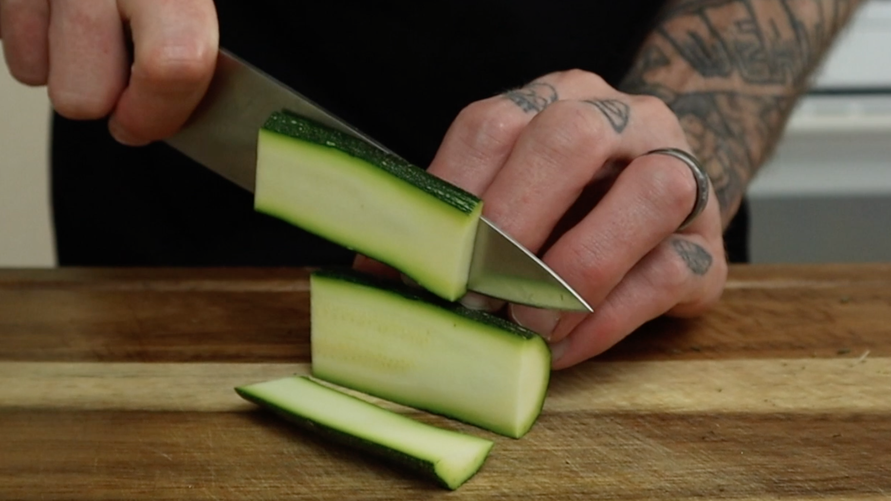 cutting zucchini into strips