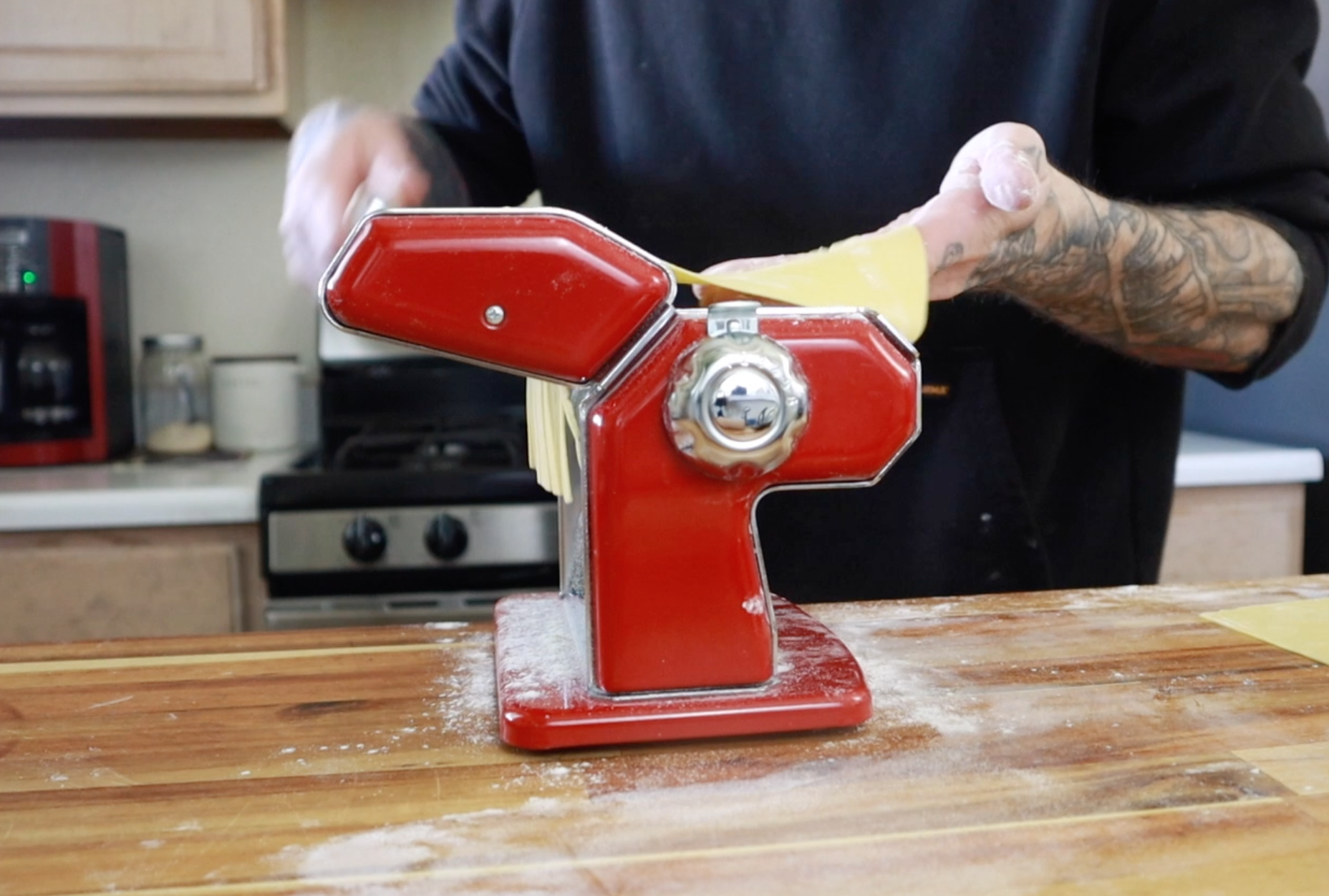 rolling the pasta dough in the die