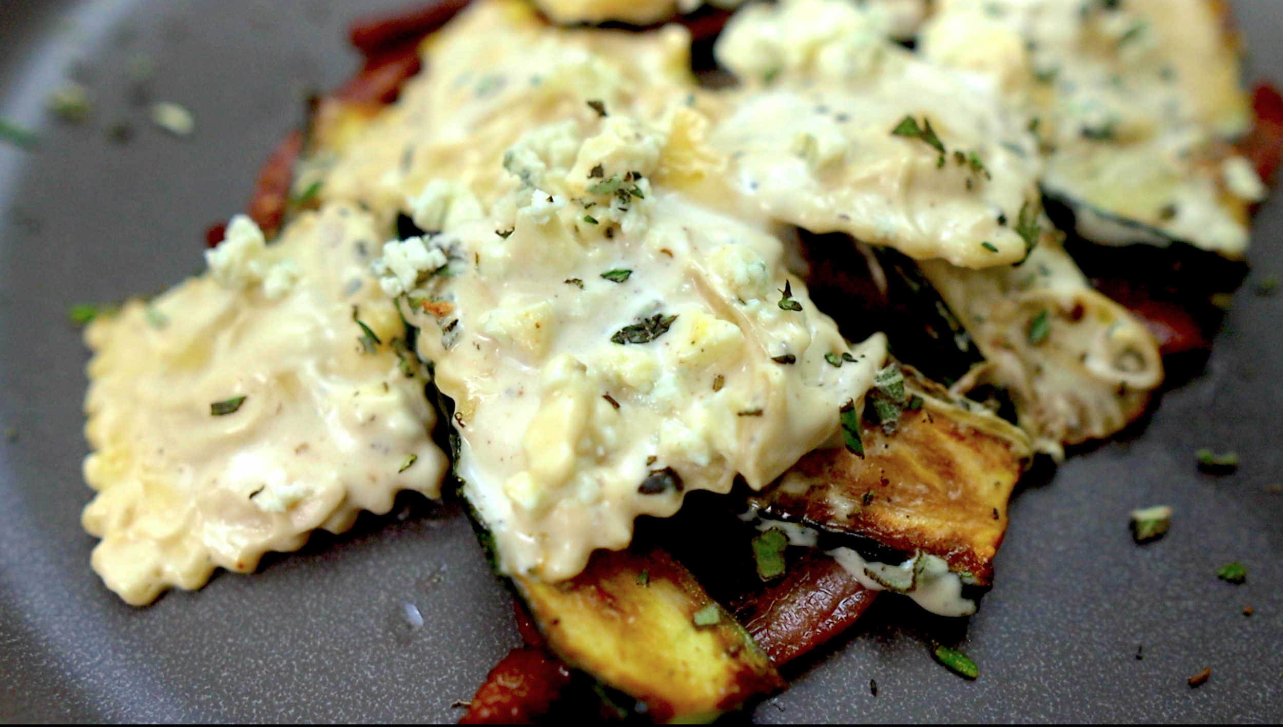 Ravioli on a plate with gorgonzola cream sauce