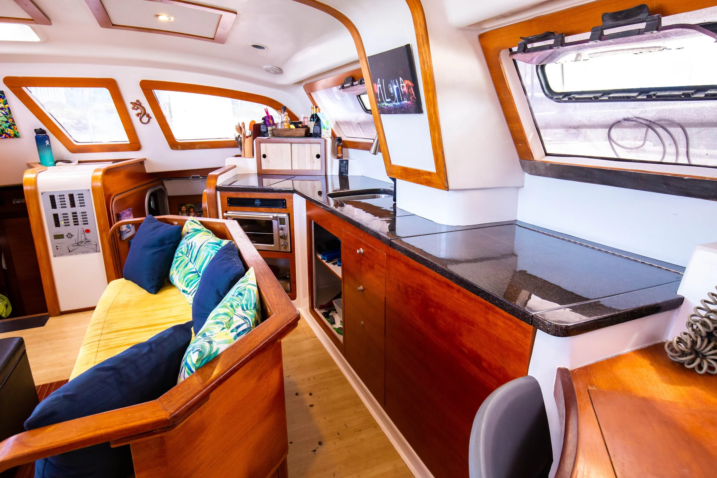 Inside seating in the saloon on Pau Hana with updated galley