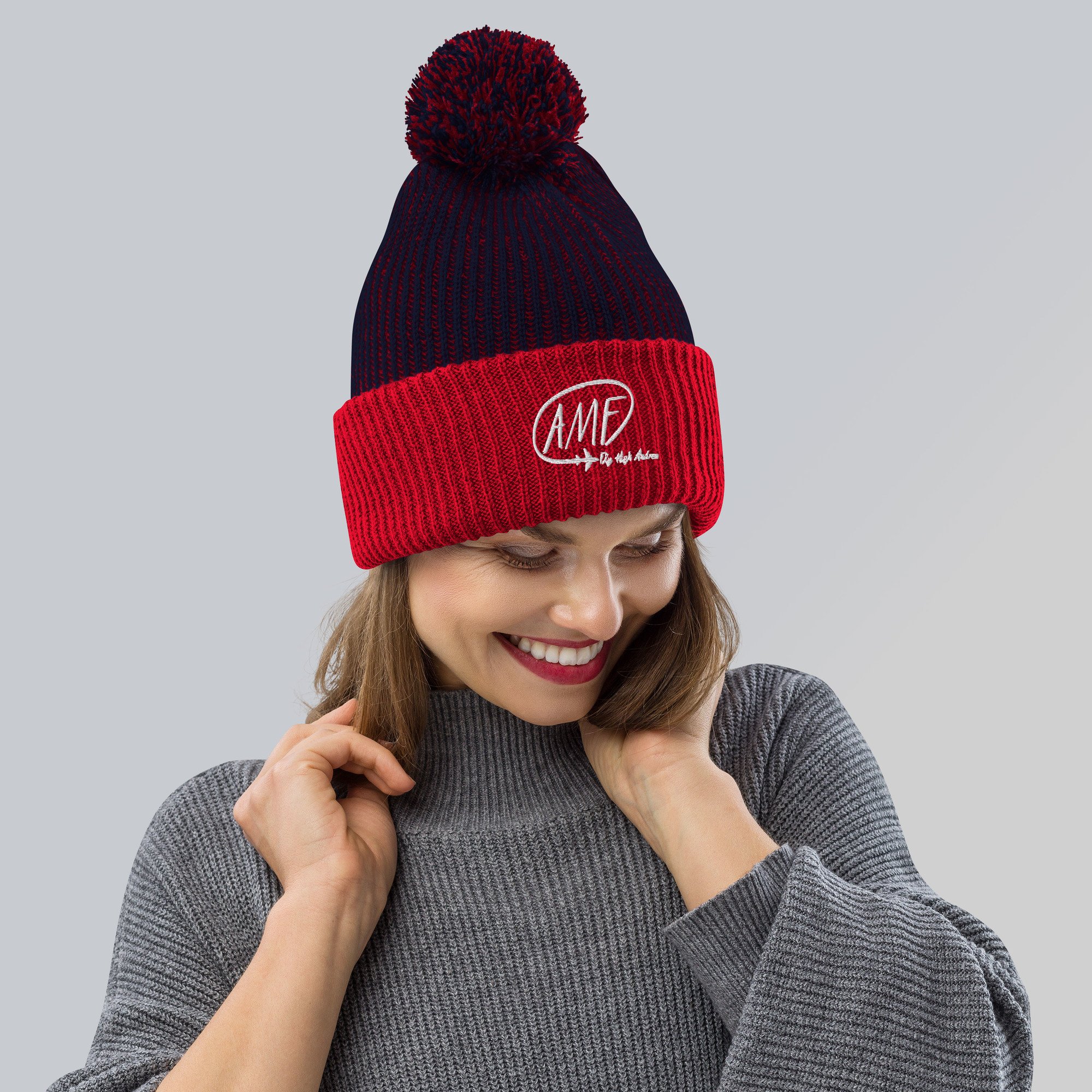 speckled-pom-pom-beanie-navy-red-front-638e58958ba77.jpg