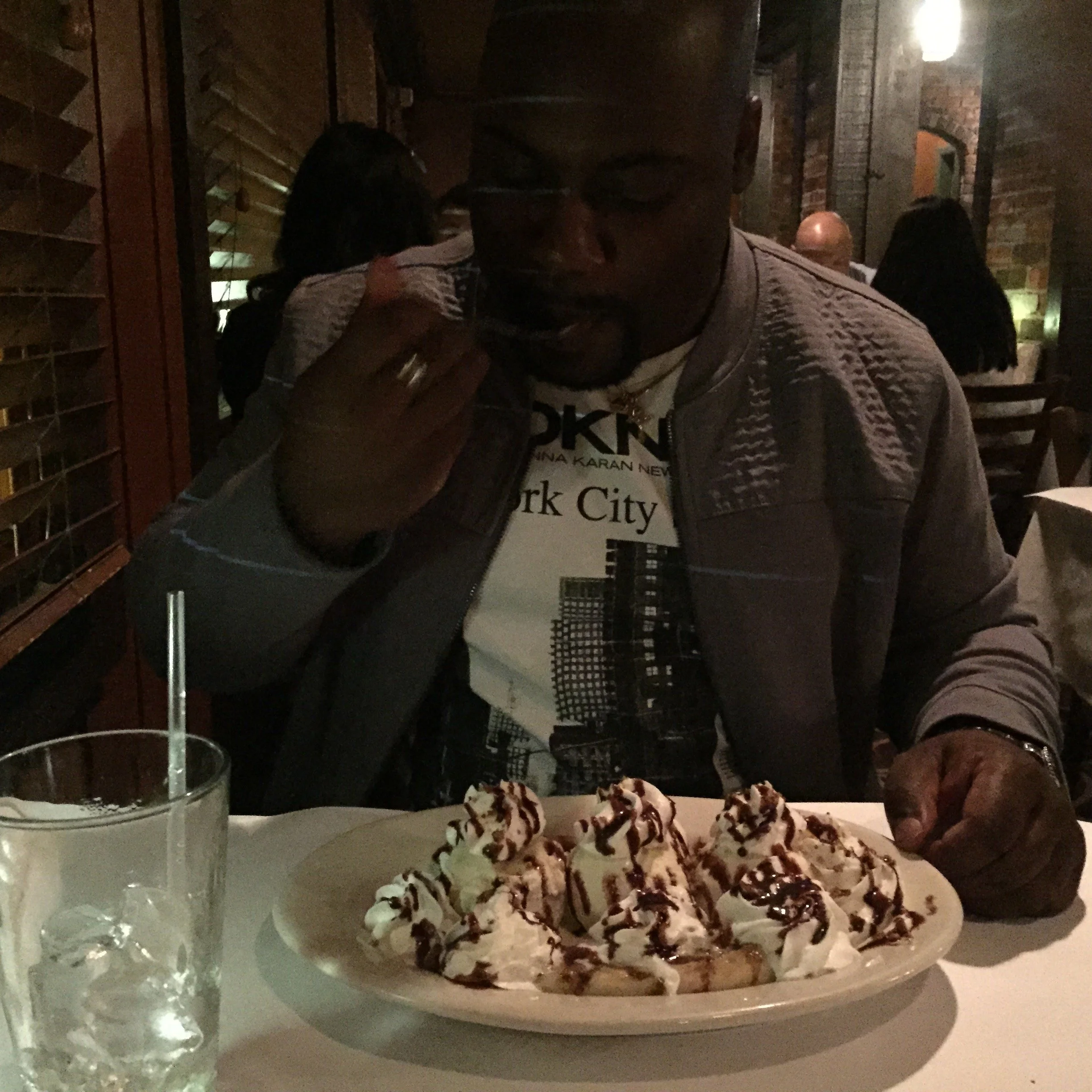Stephen Gill enjoying a banana split during a restaurant visit.