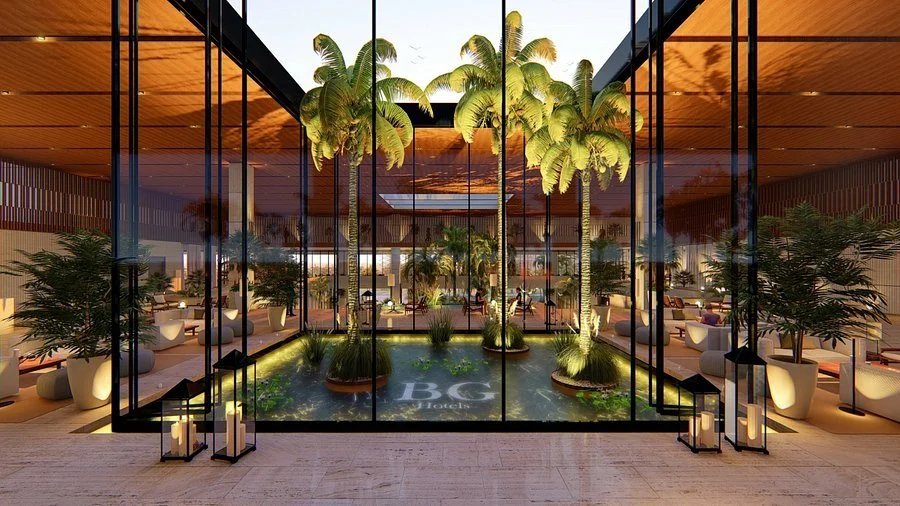Elegant indoor lounge area with large glass windows, palm trees, potted plants, and seating, with the BC Hotels logo on a pool of water in the foreground.