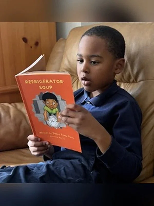 young-reader-enjoying-refrigerator-soup.jpg