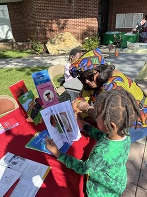 children-exploring-books-at-an-outdoor-reading-event.jpg