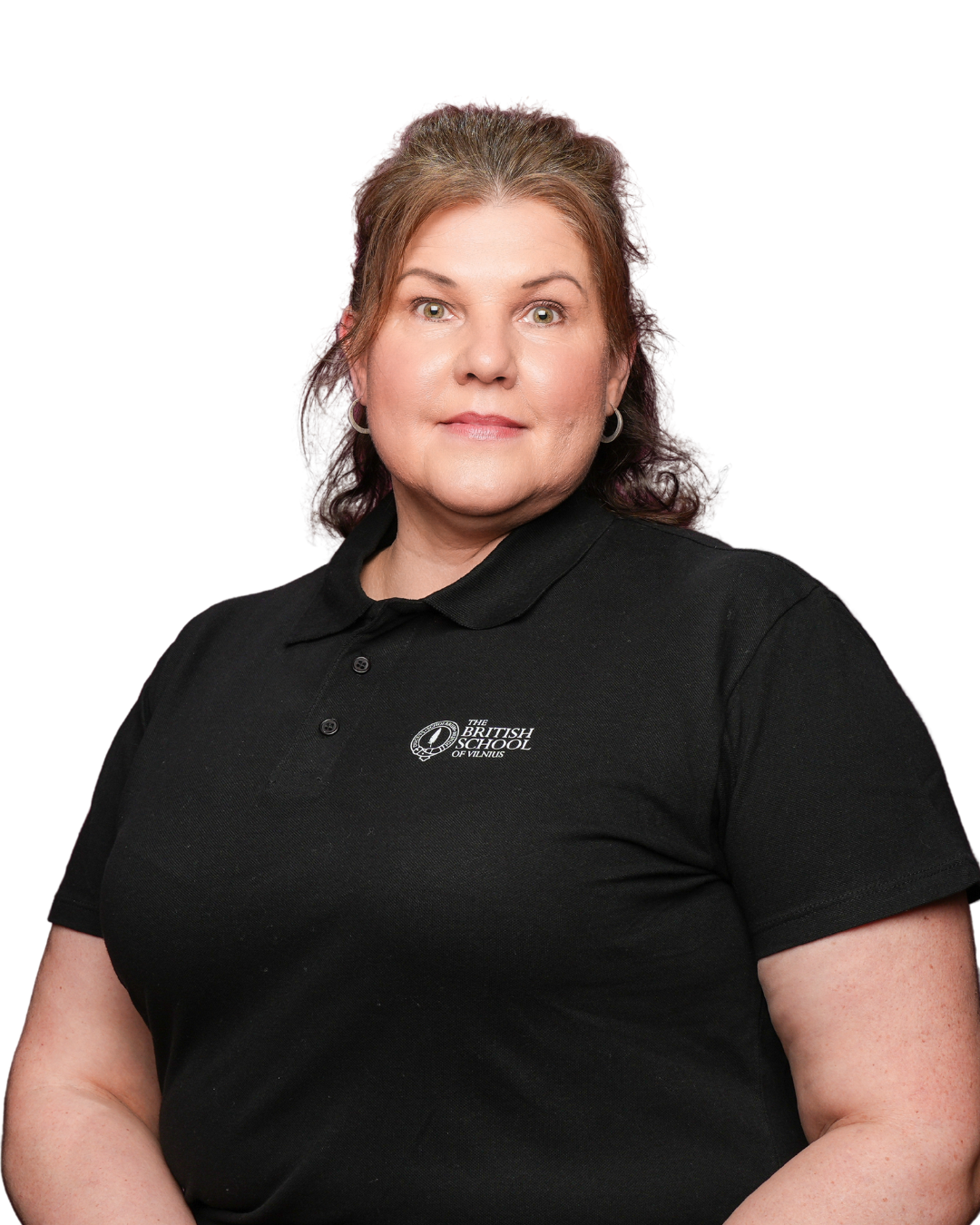 A woman with blonde hair styled with a side part, wearing a black collared shirt with a logo, smiling, against a plain white background.