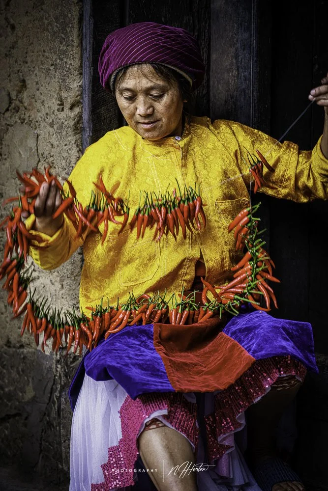 Hmong lady with chilli peppers Ha Giang