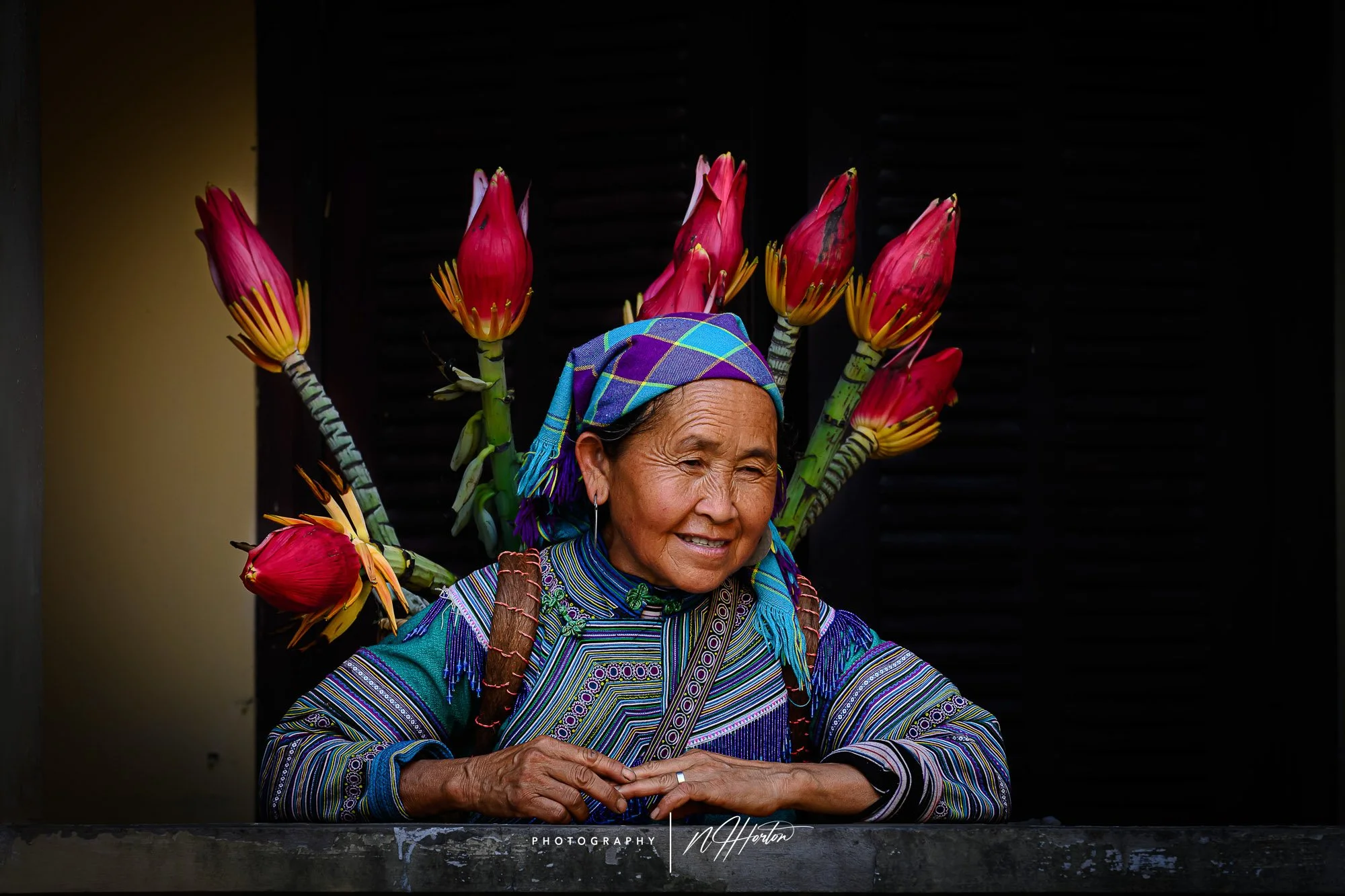 Photographer taking pictures of dramatic rice terraces in Ha Giang, North Vietnam.