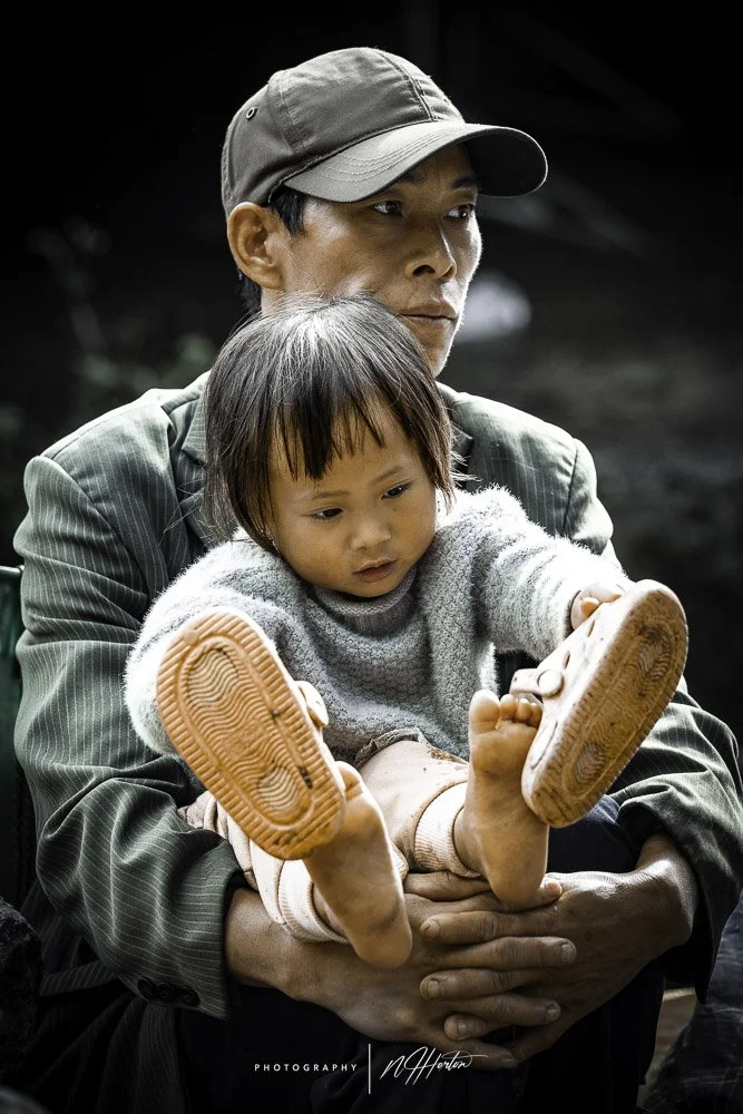 Father and daughter in market North Vietnam