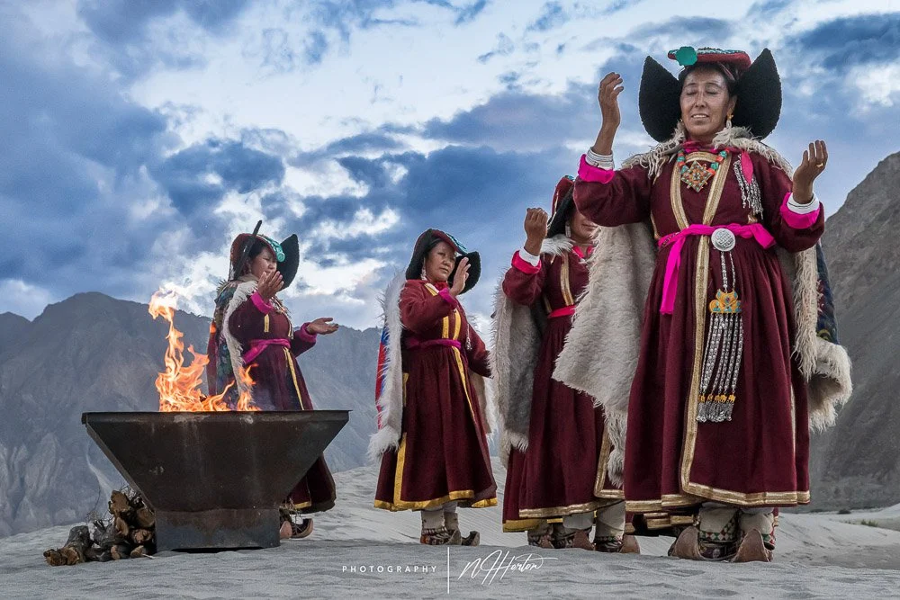 Dancing with fire in sand dunes Ladakh India