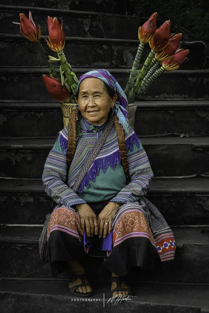 Flower Hmong woman with flower basket Ha Giang