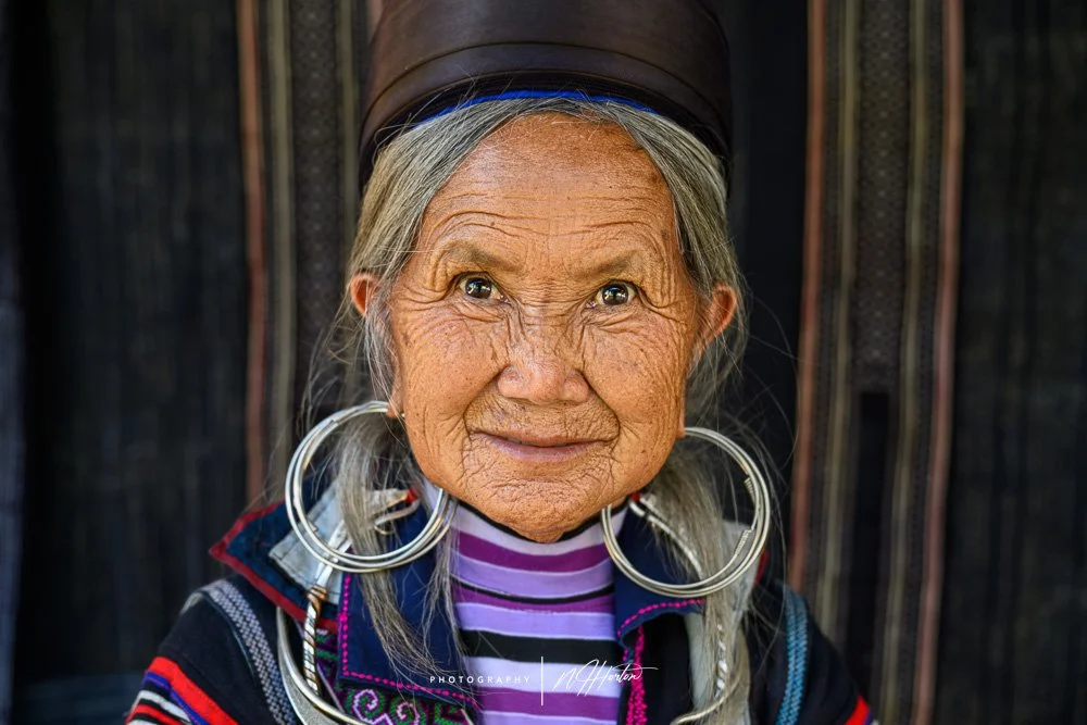 Old lady with large ear rings in Sapa, North Vietnam