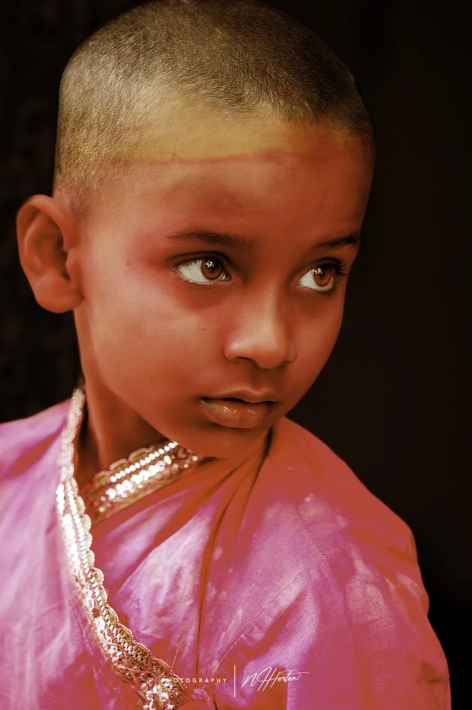 Boy-with-red-face-at-Holi-festival-Nandgoan-India