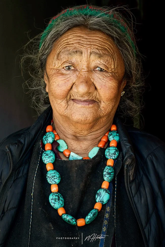 Portrait of old lady in classic dress in Ladakh
