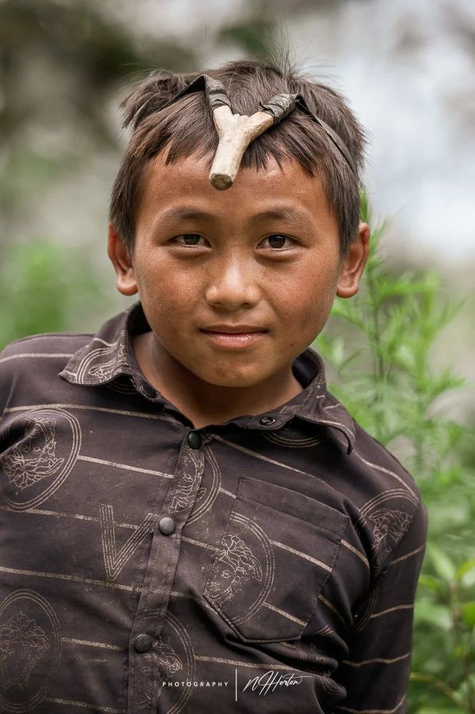 Young boy with catapult North Vietnam
