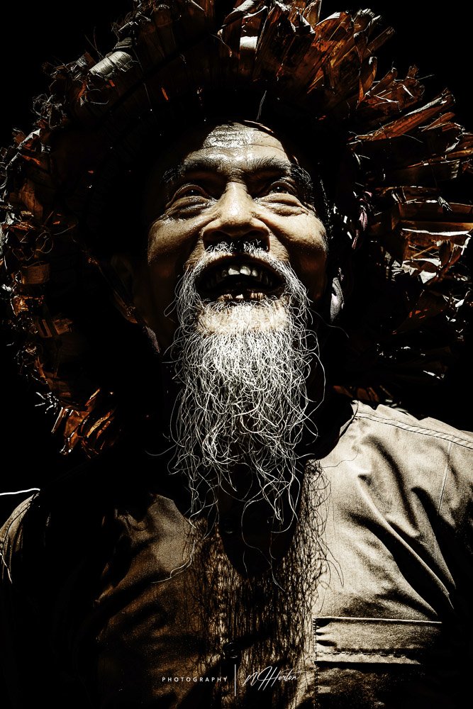 Portrait of old man in cave, Ninh Binh, Vietnam.