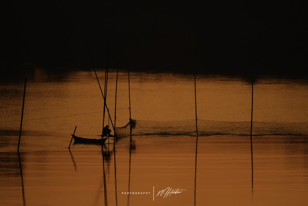 Man-looking-after-fishing-nets-Assam-India