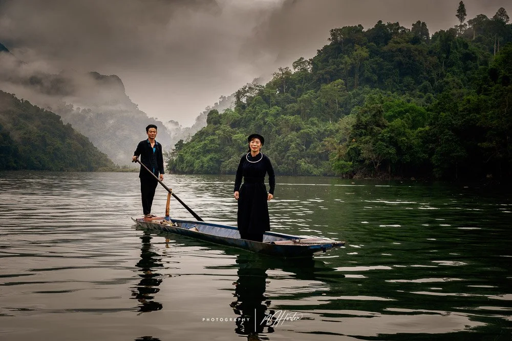 Fishing boat at dawn on Ba Be Lake, North Vietnam.