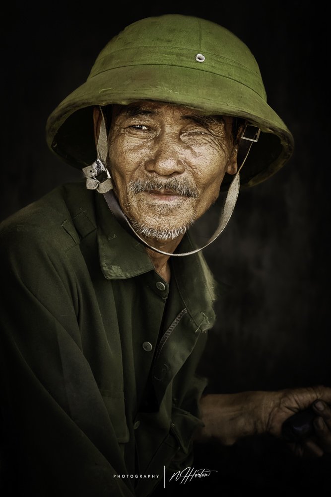 Portrait of old man in Hat, Ninh Binh, Vietnam.
