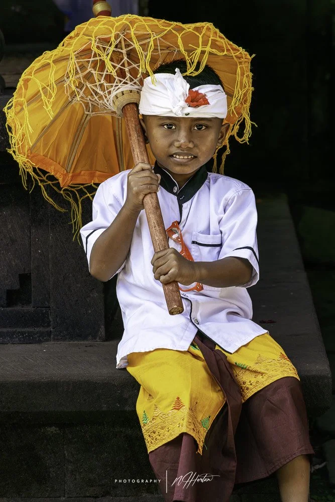 Portrait of young boy in Bali temple, Indonesia