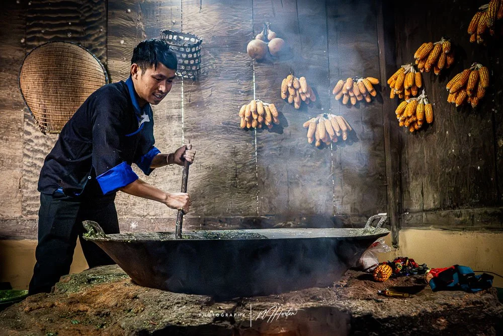Hill-tribe man working in Corn shed Sapa, North vietnam.