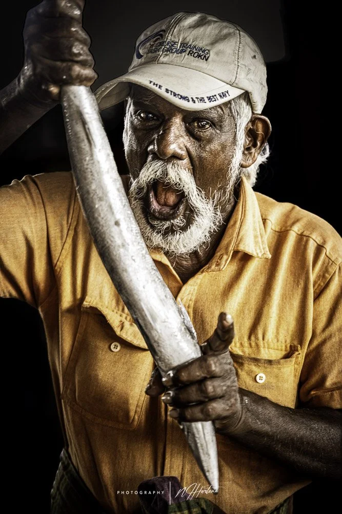 Portrait of Sri Lankan man with fish