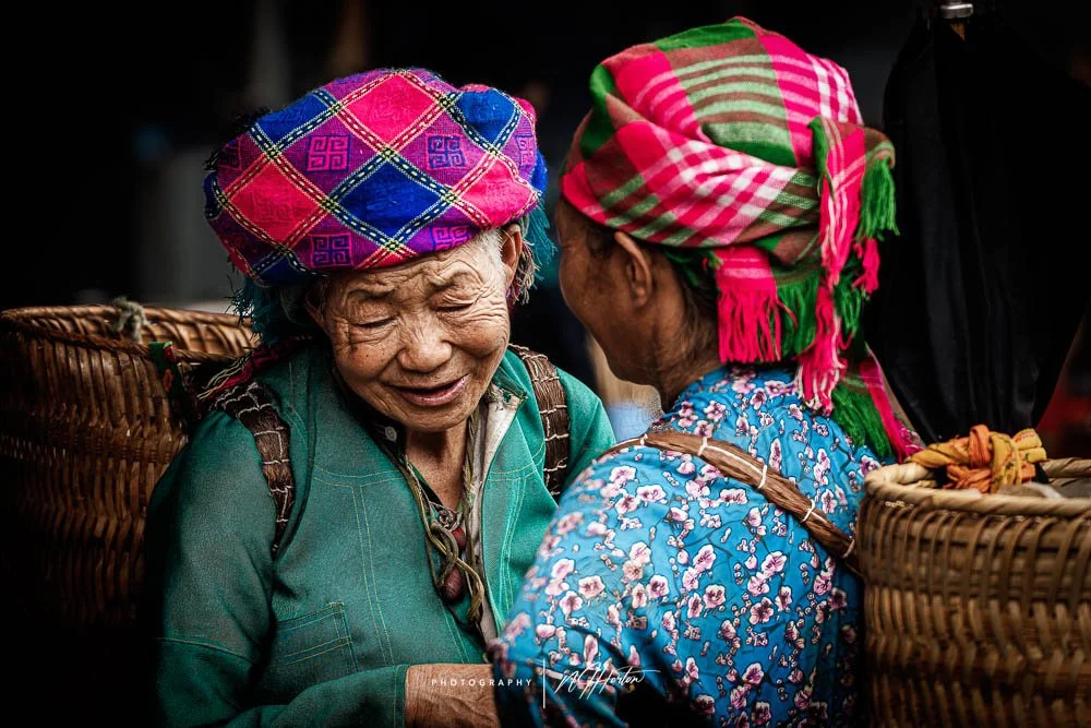 Local ladies talk together at Dong Van market, North Vietnam.