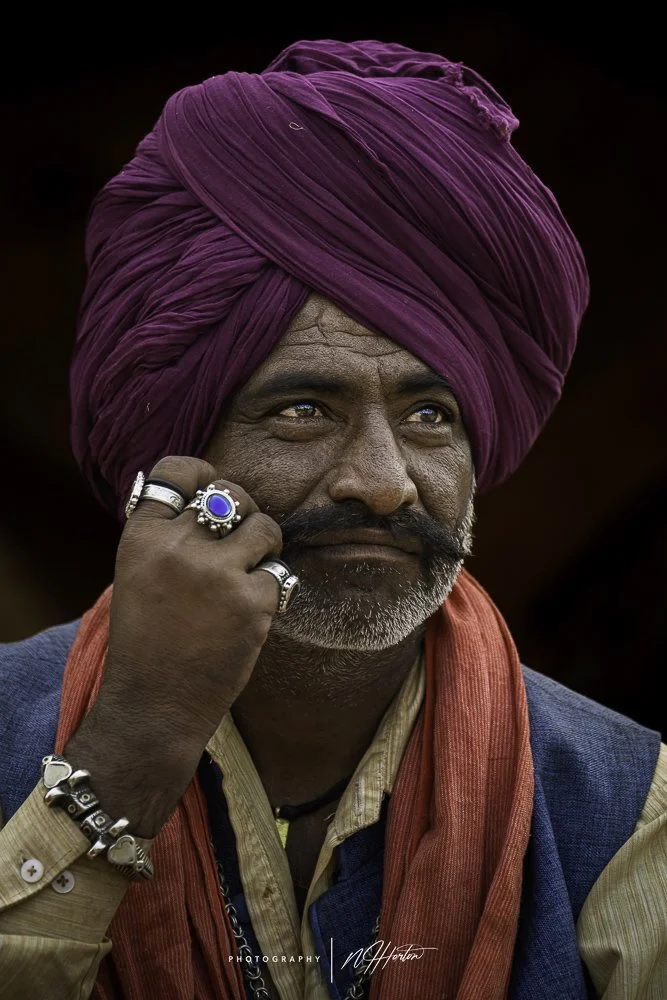 Portrait-of-man-with-rings-pushkar-camel-fair-Rajasthan.jpg