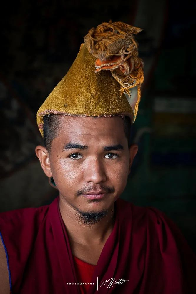 Portrait of young monk in Thiksey monastaryin Ladakh