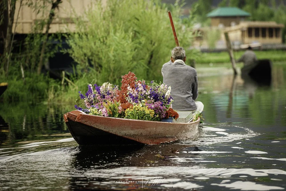 Boat man selling flowers Dal Lake, Kashmir