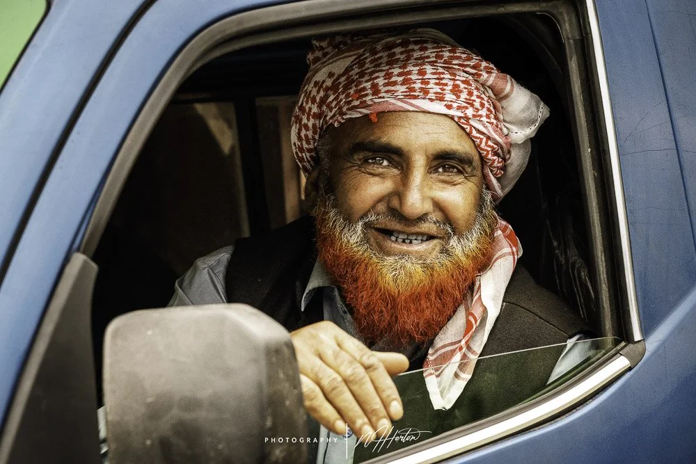 Man with red beard in car, Kashmir