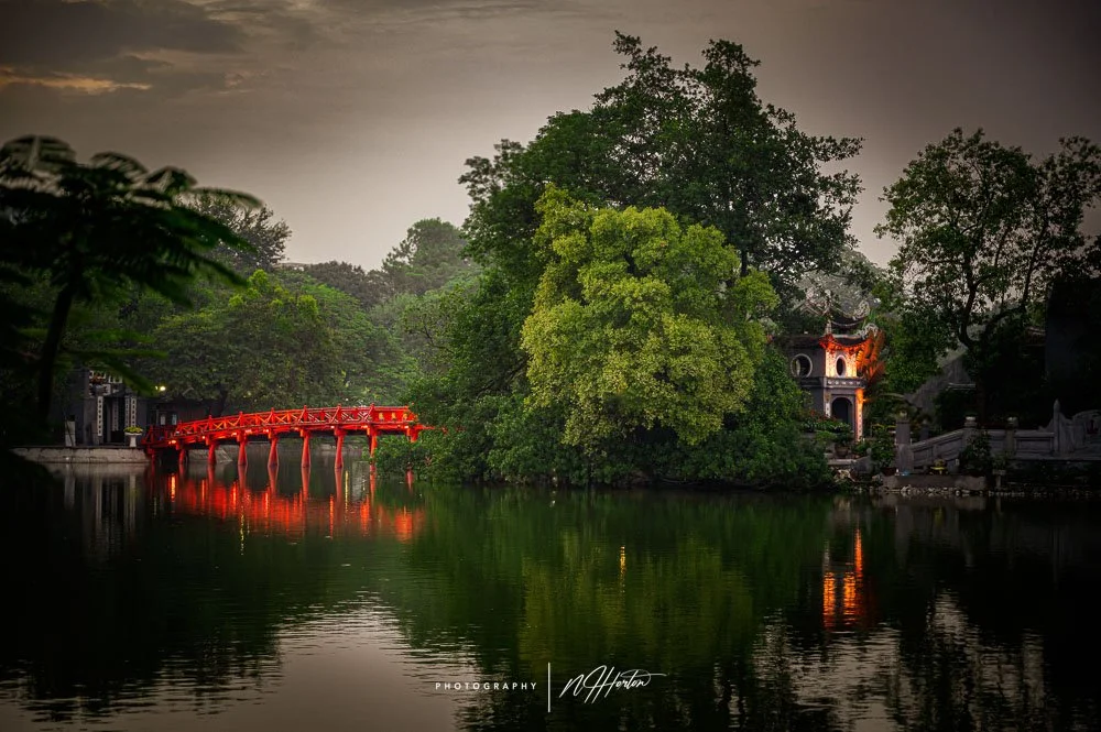 Red bridge to small island on Hoan Kiem lake, Hanoi, North Vietnam.