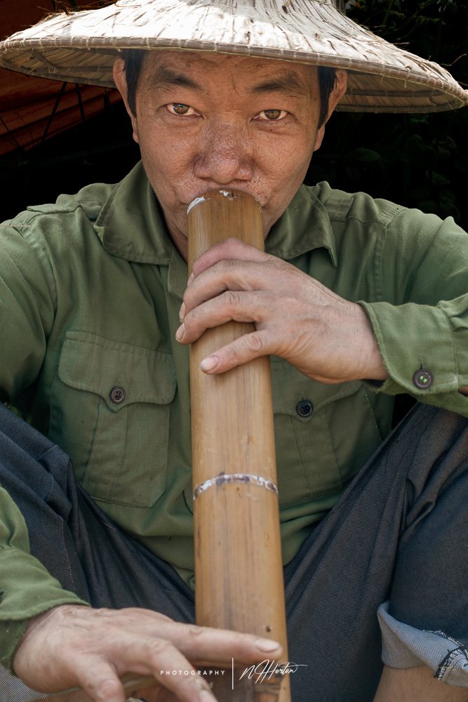 Guy smoking pipe North Vietnam