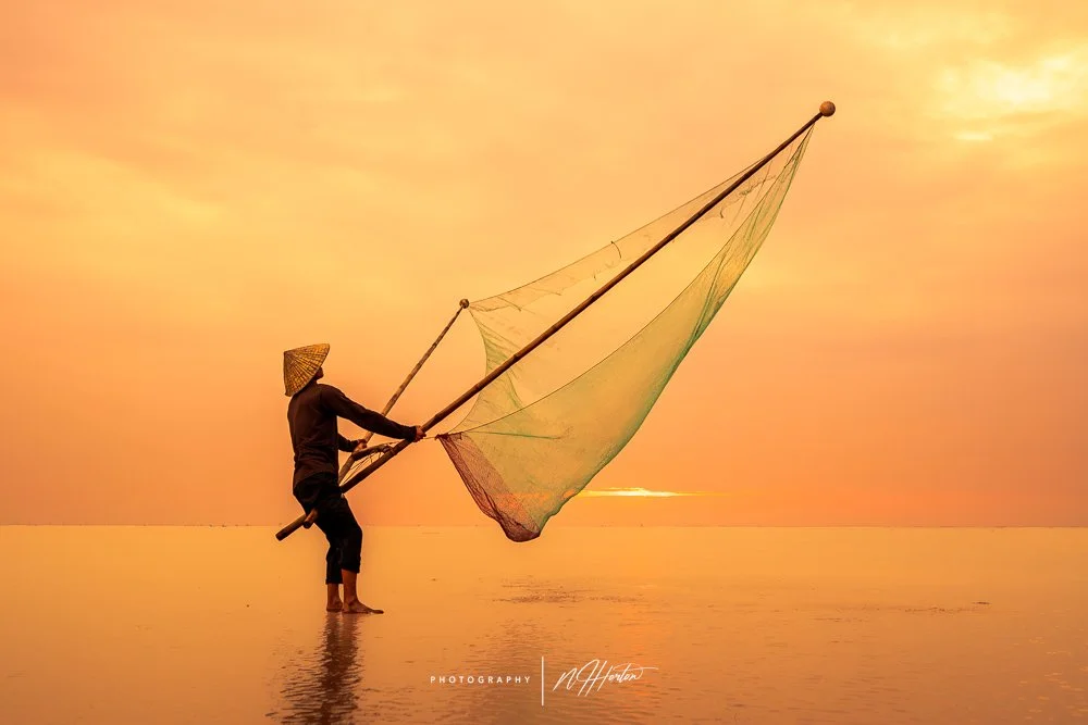 Fishing on beach at Thuy Hai, North Vietnam, Asia.