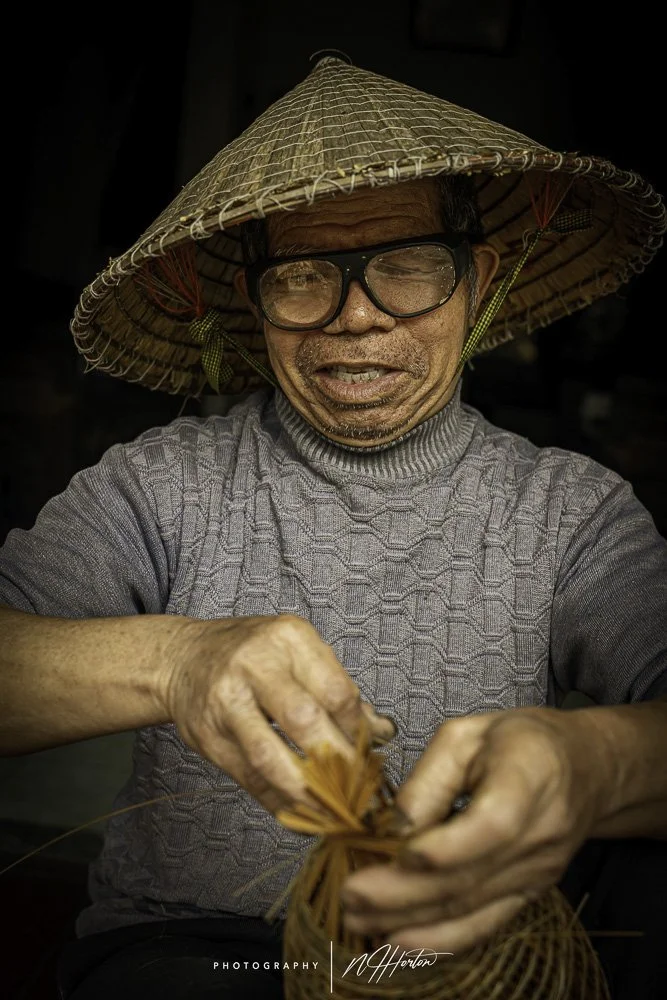 Portrait of man making fishing net, BNorth Vietnam.