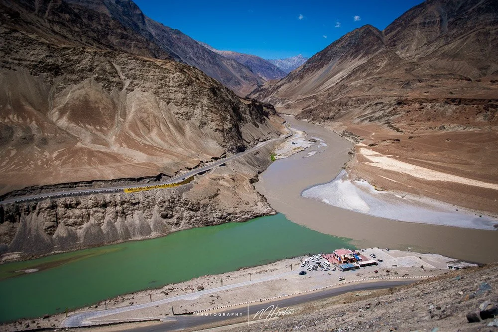 Two-colour rivers where the Indus and Zanzkar rivers meet , India.