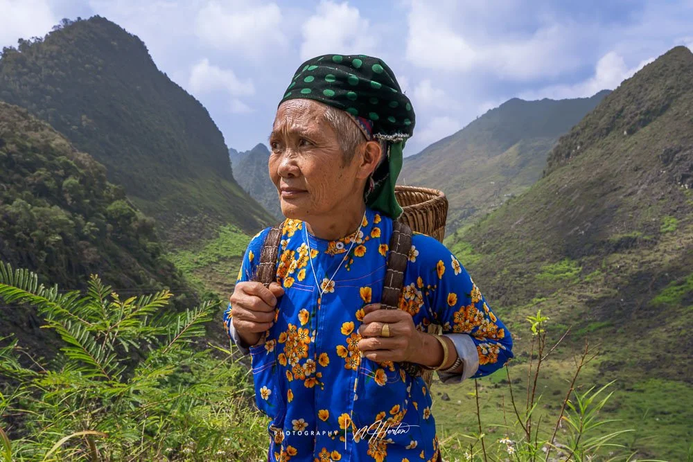 Lady with basket near Meo Vac, North Vietnam.