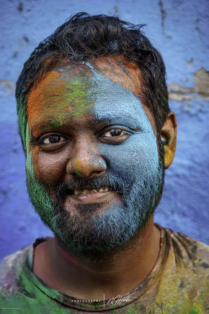 Man-blue-face-at-Holi-festival-Nandgoan-India